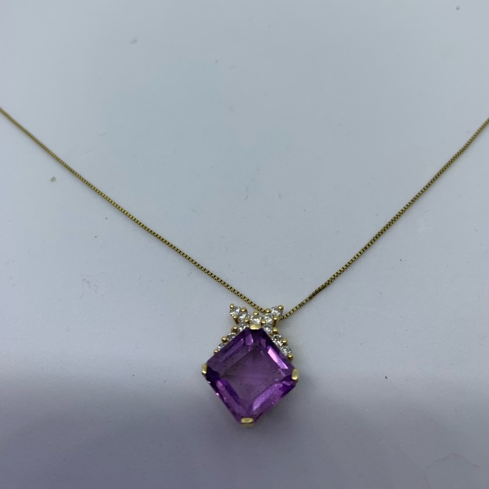 Amethyst pendant with small diamond chips